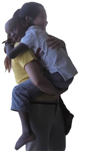 在牙買加殘障兒童收留所，進門之際，男孩跑到我面前，伸手示意叫我抱他。他缺乏語言能力，用手活潑地指示我帶他在房間裡走來走去。累了，便將頭放在我肩上。