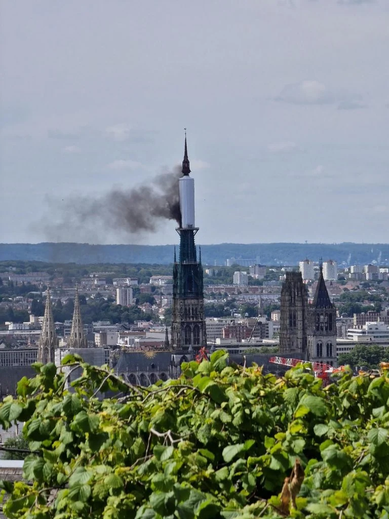 Smoke_billows_from_the_spire_of_Rouen_Cathedral_in_Rouen_northern_France_on_July_11_2024._Photo_by_Patrick_Streiff_AFP_via_Getty_Images.webp